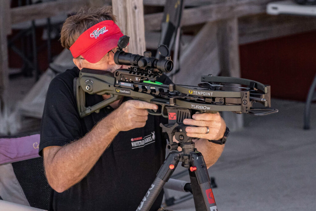 Man aiming crossbow