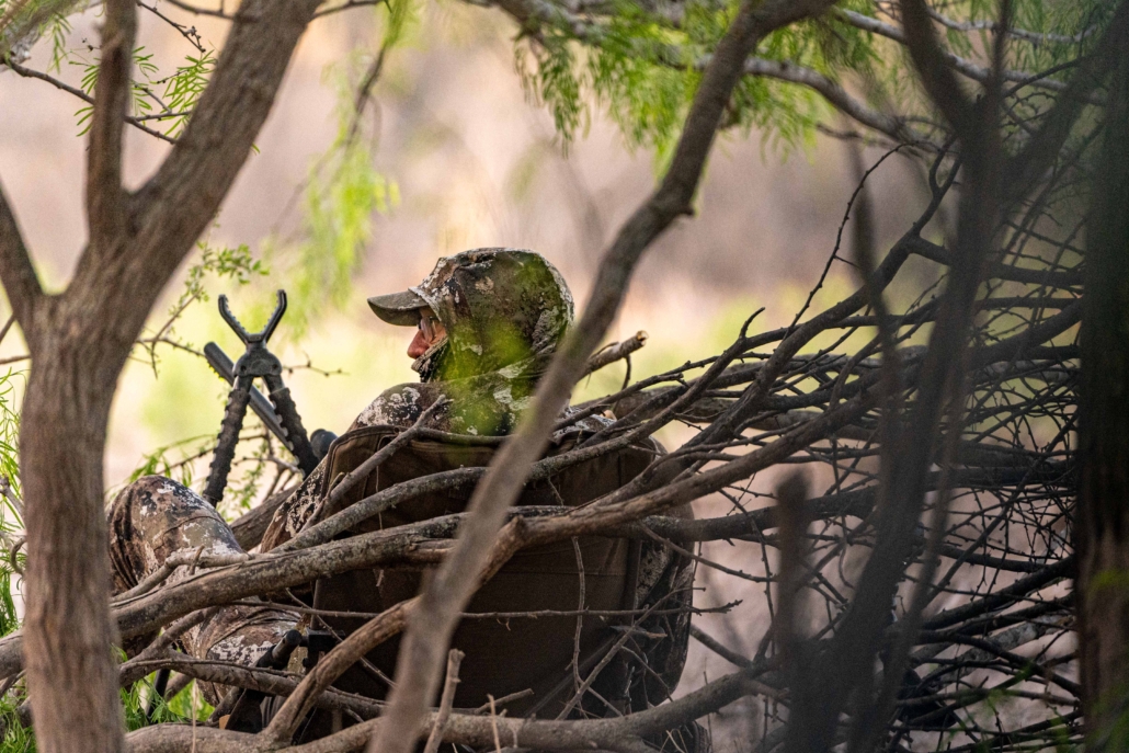 hunter sitting while turkey hunting
